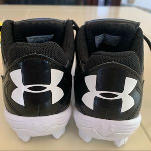 Little boys under armour cleats .